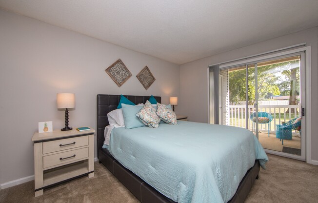 Master Bedroom with exterior doorway to outdoor space at St. Croix Apartments in Virginia Beach VA