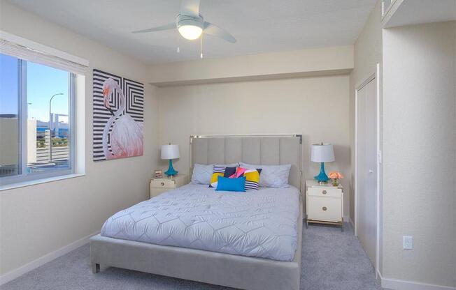 a bedroom with a bed and a ceiling fan at Icon One, Daytona Beach