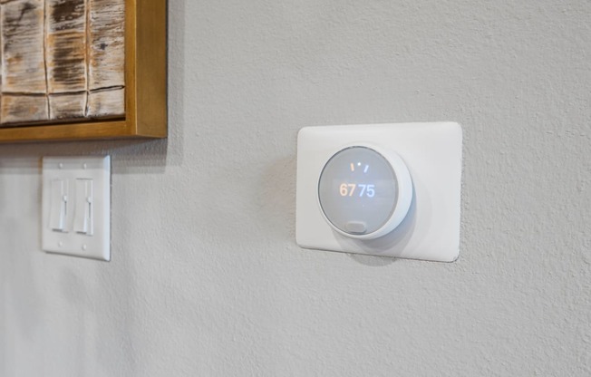 thermostat inside of an apartment at ironridge at hill country village