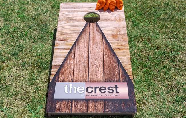 a chopping board with a sign on it on the grass