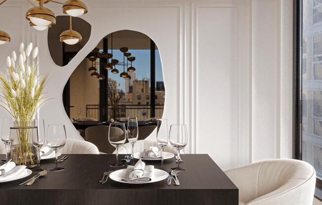 a dining room with white chairs and a black table