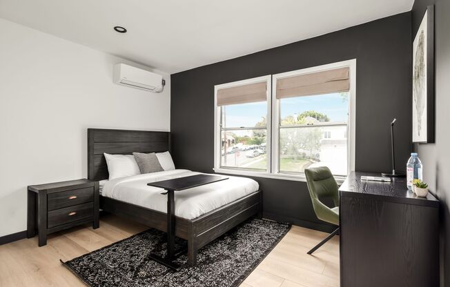 A 4 Bedroom, 3 Bathroom apartment with common areas and a fully functional kitchen at 1476 Malcolm Ave.