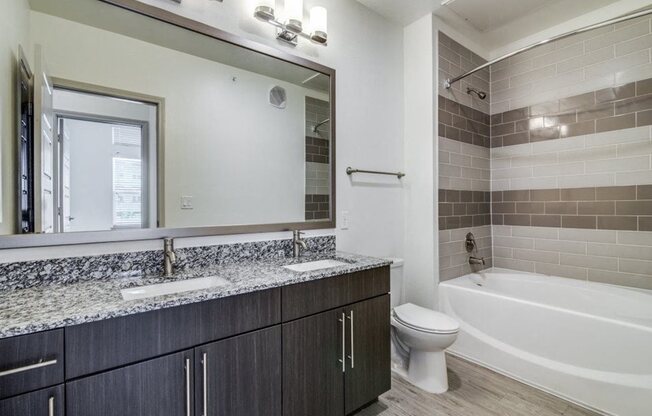 Pet-Friendly Apartments in Rowlett, TX - Harmony Luxury Apartments Bathroom with Vanity and Stainless Steel Fixtures
