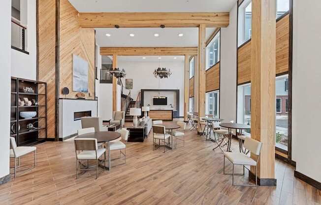 A modern dining room with wooden floors and furniture.