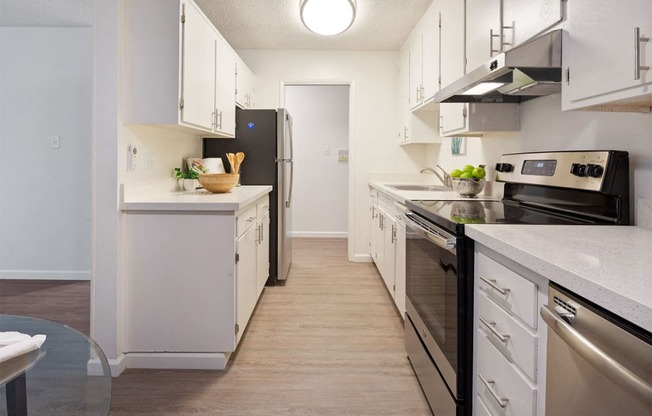 White Cabinetry And Appliances In Kitchen at Marine View Apartments, California, 94501