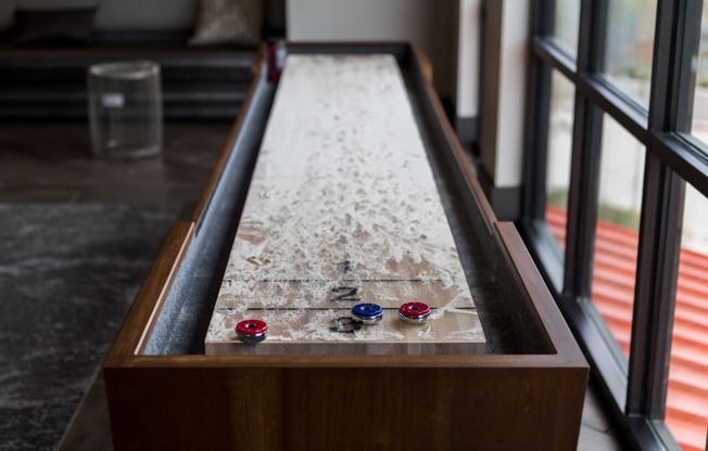 a ping pong table in the living room of a house