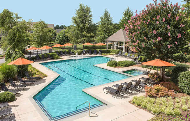 pool with sundeck with chairs