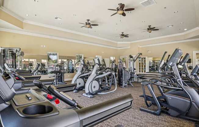 A spacious gym with a variety of exercise equipment.