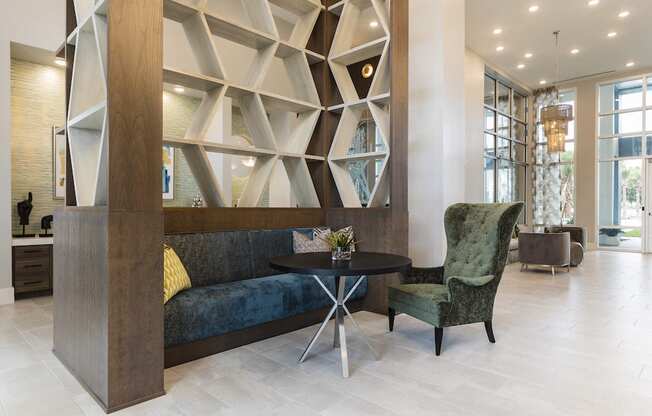 sofa, chair, and table in lobby nook at Residences at The Green