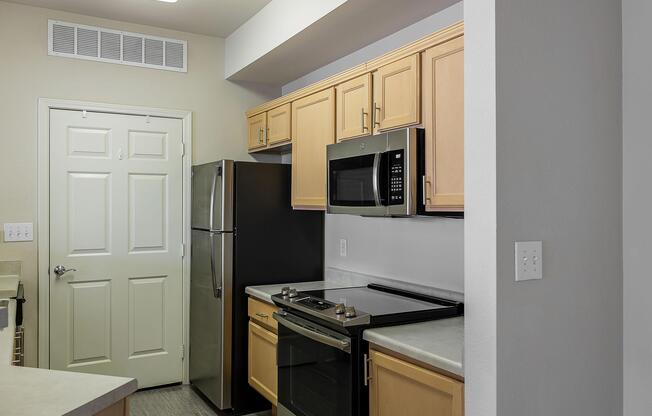 a kitchen with a sink and a refrigerator