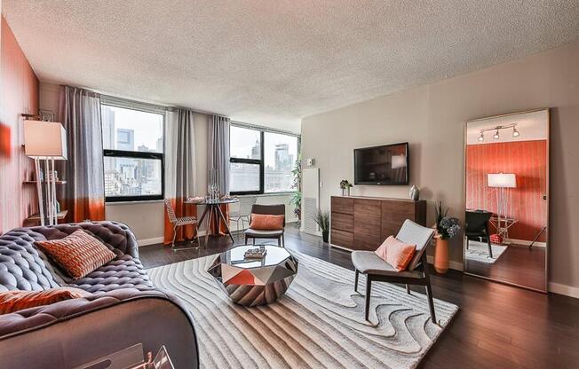 Living room with couch, table and lamps at West77, Chicago, IL, 60654