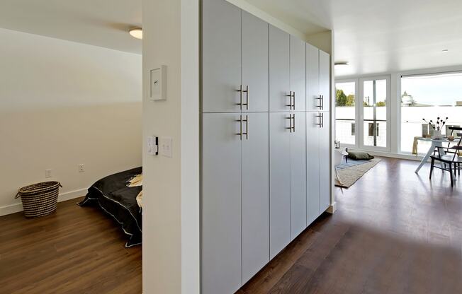 Build-in hallway storage with bedroom and living room visible in the distance at 19th & Mercer, Seattle Washington