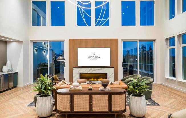 Expansive windows and refined finishes make Modera Shoreline’s lounge a bright, welcoming retreat perfectly suited for gatherings or quiet evenings in.