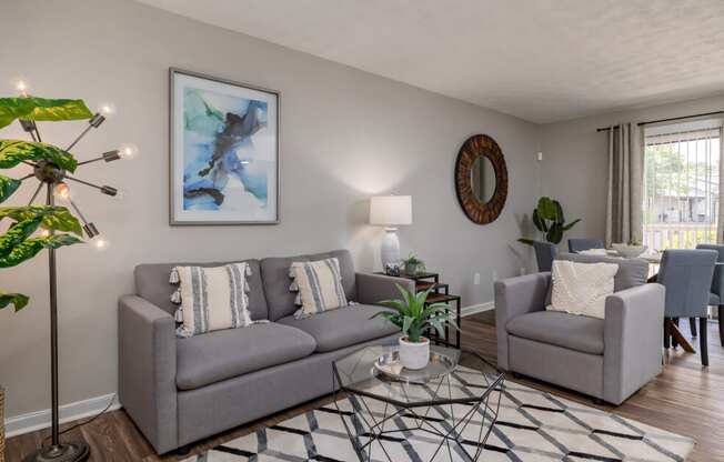 a living room with a couch and a chair and a tableat Glen Hollow, Georgia 30034