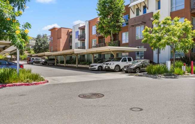 a rendering of a parking lot in front of an apartment building