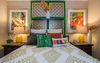 a bedroom with a bed and painted
