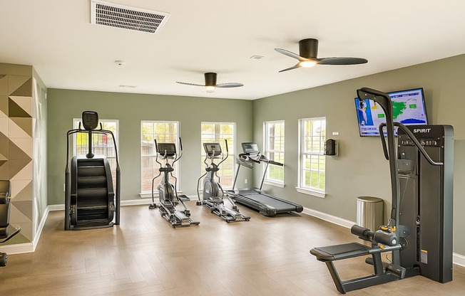 A spacious home gym with a variety of exercise equipment.