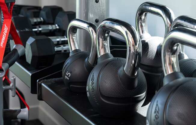 a group of headphones on a docking station in a gym