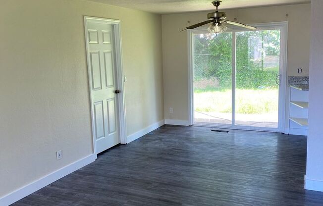 4 Bedroom, 2 Bathroom House with Large Fenced Backyard, New Vinyl Plank Flooring, Granite Countertops and Updated Bathroom with New Surround