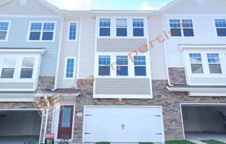 Beautiful 3 Story 3 Bedroom 2.5 Bath Townhome w/ First Floor Office, Patio, and 2-Car Garage in Riverwalk, Raleigh. Available November 5th!