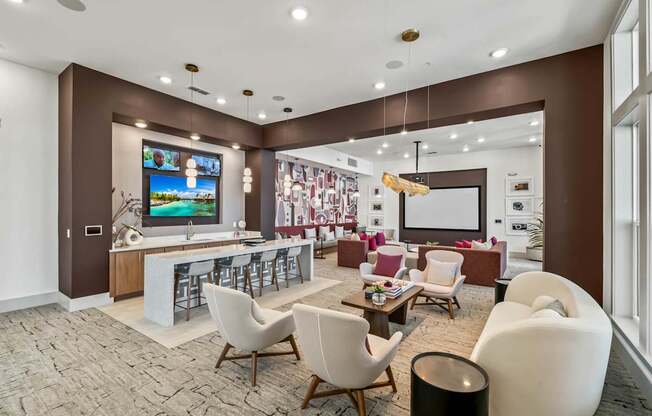 A modern living room with a large television and comfortable seating.