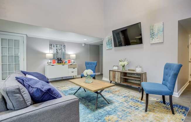 Westchase Apartments in Harvey LA photo of clubhouse seating with couch and tv