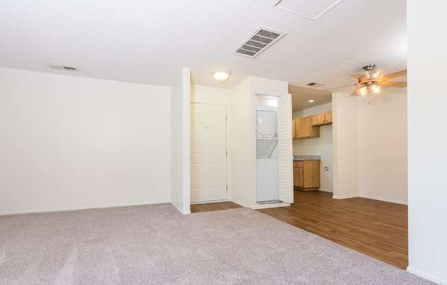 Living room, dining area with in unit washer and dryer at Woodbend, Alta Loma, 91701