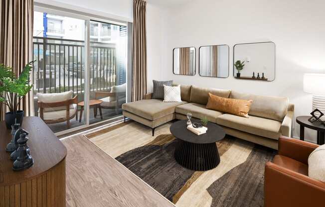 a living room with a couch and a table at Aura Vegas Apartments, Las Vegas, Nevada