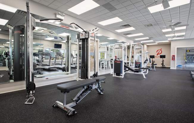 a photo of a gym with free weights and other exercise equipment