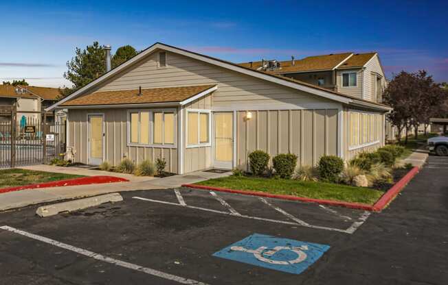 an empty parking lot in front of a house