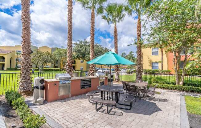 Outdoor Grilling Station at Mission Club Apartments in Orlando, FL