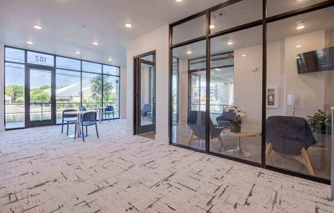 A room with a stone floor and glass walls.