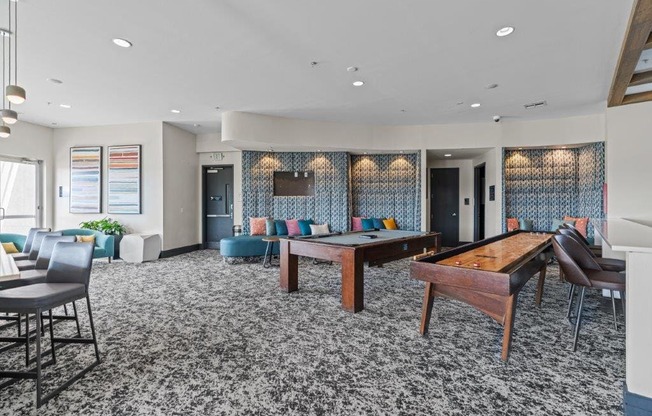 a room filled with furniture and a pool table