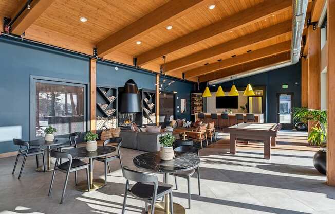 A modern cafe with wooden tables and chairs.