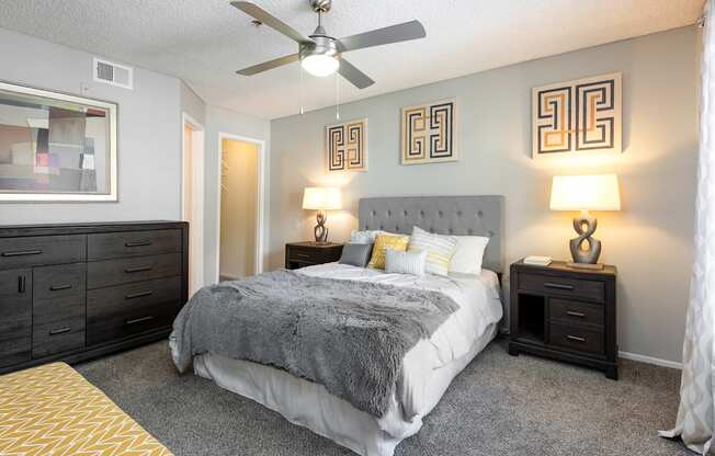 the preserve at ballantyne commons bedroom with bed and ceiling fan