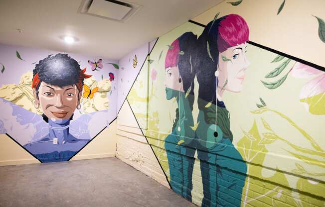 a mural of two people on a wall in a room  at The Lady, Columbia, South Carolina