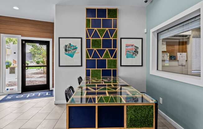 a glass table with a geometric design in front of a door