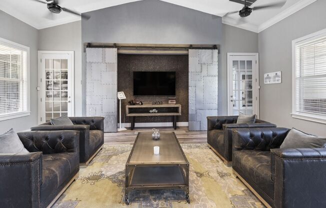 a living room with couches and a coffee table