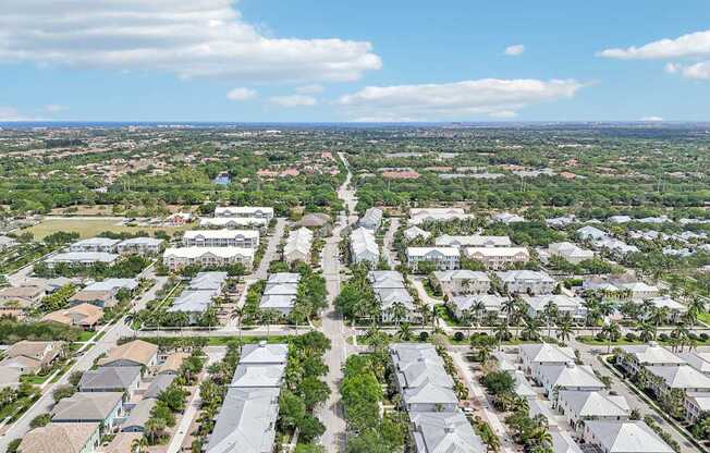 A bird's eye view of a residential area with houses and streets.