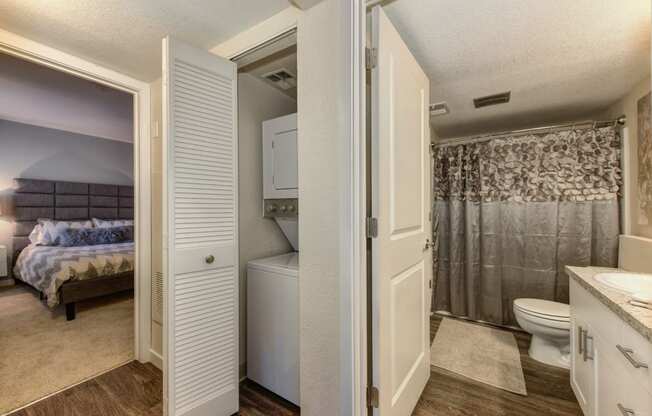  In Unit Washer Dryer, Hardwood Inspired Floor and Bathroom with Shower Curtains