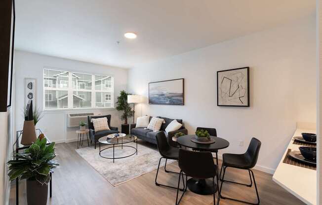A living room with a black and white color scheme.