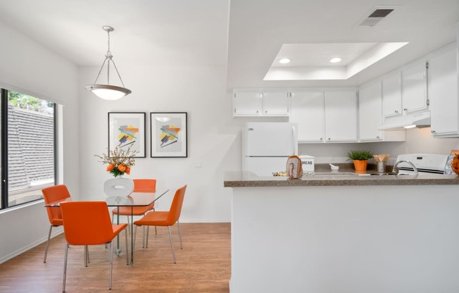 a kitchen and dining area in a 555 waverly unit