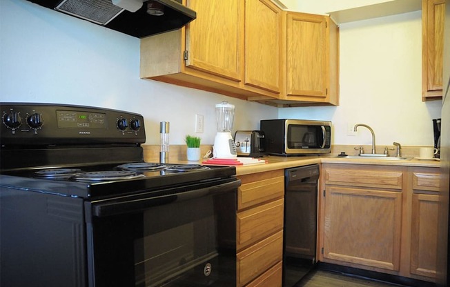 All electric galley kitchen at Pickwick Farms Apartments in Indianapolis, IN 46260