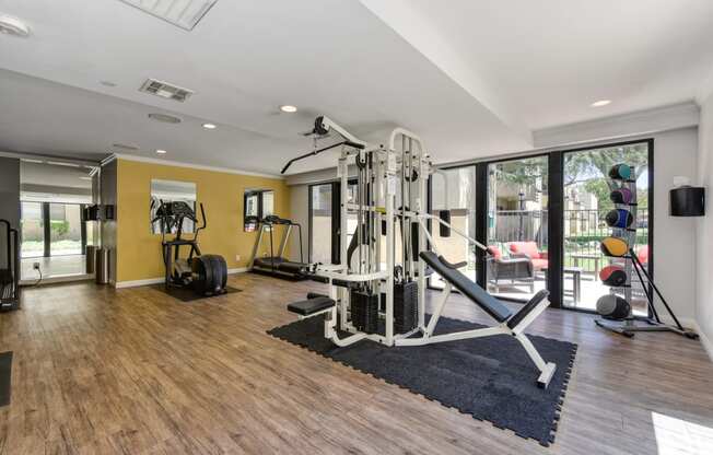 Communit Fitness center with yellow accent wall