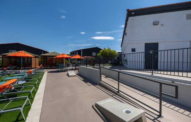 A sunny day at the outdoor seating area with orange umbrellas.