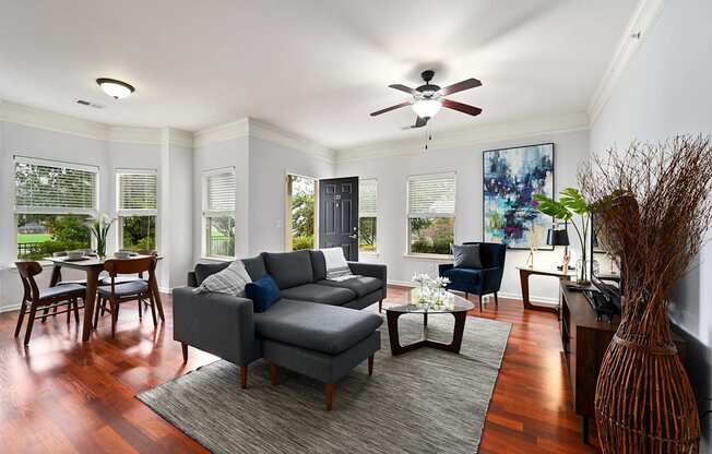 a living room with a couch and a ceiling fan at Sovereign at Overland Park, Kansas, 66213