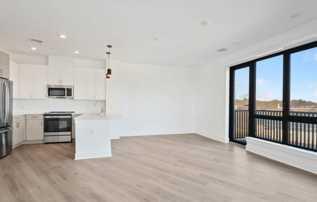 Living Room with Balcony and Hard Surface Flooring