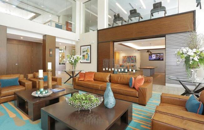 a large living room with couches and a table