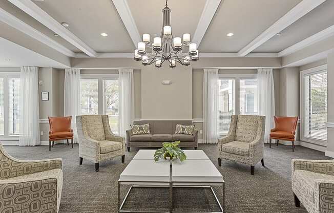 a living room with couches and chairs and a coffee table