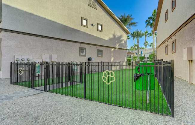 A black metal gate with a white logo on it.